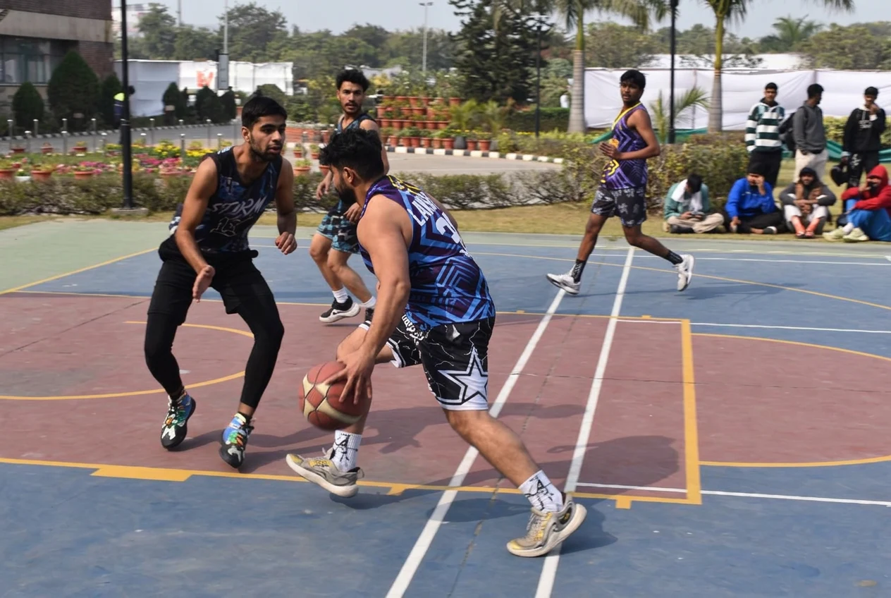 Basketball players competing on the campus court